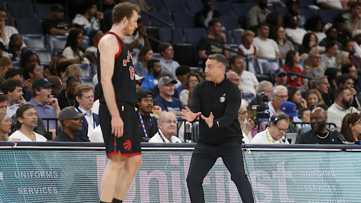 Apr 3, 2026; Memphis, Tennessee, USA; Toronto Raptors head coach Darko Rajakovic gives direction to center Jakob Poeltl (19) during the first quarter against the Memphis Grizzlies at FedExForum. Mandatory Credit: Petre Thomas-Imagn Images