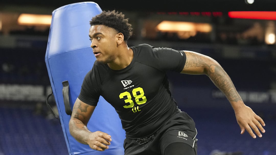 Auburn defensive lineman Keldric Faulk runs through on-field defensive line drills at the NFL Scouting Combine.