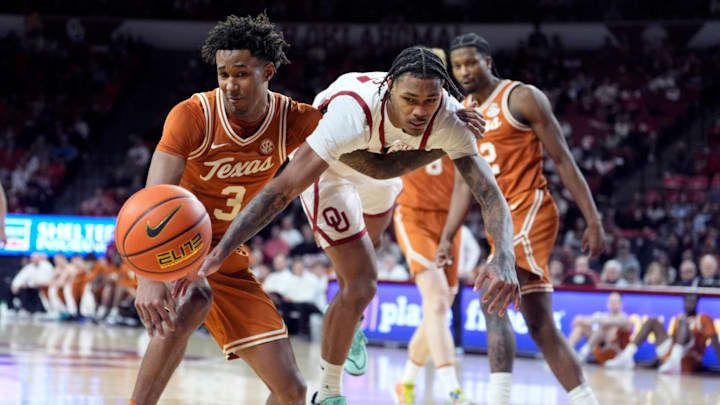 Oklahoma's Jeff Nwankwo (3) and Texas' Dailyn Swain (3) scramble for a loose ball in the second half of the men's college basketball game between the Oklahoma Sooners and the Longhorns at Lloyd Noble Center in Norman, Okla., Saturday Jan. 31, 2026.