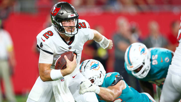 Aug 13, 2022; Tampa, Florida, USA;  Tampa Bay Buccaneers quarterback Kyle Trask (2) is pressured by Miami Dolphins linebacker Porter Gustin (96) in the second quarter during preseason at Raymond James Stadium. Mandatory Credit: Nathan Ray Seebeck-USA TODAY Sports