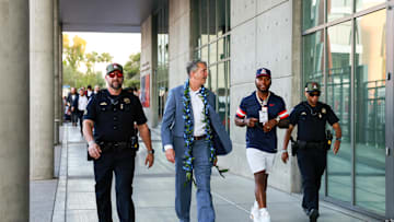 Oct 5, 2024; Tucson, Arizona, USA; Arizona Wildcats head coach Brent Brennan walks down the Wildcat Walk with Arizona Wildcats Honorary Captain Robert Golden before the game against Texas Tech Red Raiders at Arizona Stadium. Mandatory Credit: Aryanna Frank-Imagn Images