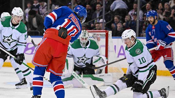 Jan 7, 2025; New York, New York, USA;  Dallas Stars forward Oskar Bäck (10) blocks a shot by New York Rangers left wing Artemi Panarin (10) during the first period at Madison Square Garden. Mandatory Credit: Dennis Schneidler-Imagn Images
