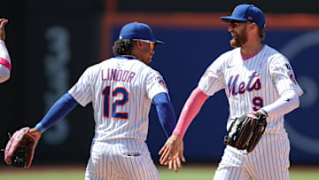 May 11, 2025; New York City, New York, USA; New York Mets left fielder Brandon Nimmo (9) and shortstop Francisco Lindor (12) celebrate after defeating the Chicago Cubs at Citi Field. Mandatory Credit: Vincent Carchietta-Imagn Images
