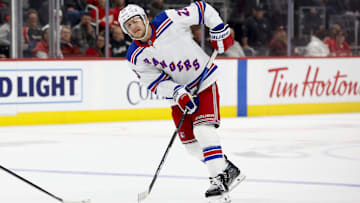 Oct 17, 2024; Detroit, Michigan, USA;  New York Rangers defenseman Adam Fox (23) skates with the puck in the third period against the Detroit Red Wings at Little Caesars Arena. Mandatory Credit: Rick Osentoski-Imagn Images