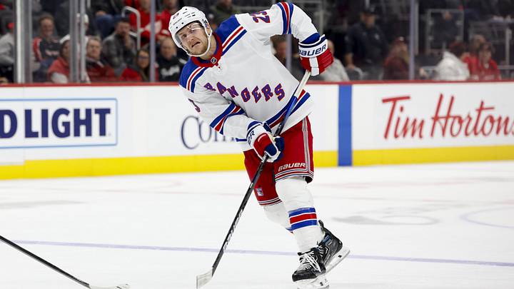 Oct 17, 2024; Detroit, Michigan, USA;  New York Rangers defenseman Adam Fox (23) skates with the puck in the third period against the Detroit Red Wings at Little Caesars Arena. Mandatory Credit: Rick Osentoski-Imagn Images