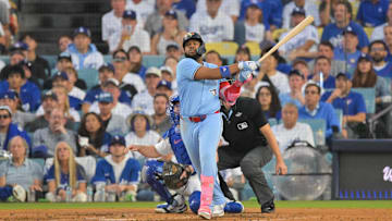 Oct 28, 2025; Los Angeles, California, USA; Toronto Blue Jays first baseman Vladimir Guerrero Jr. (27) hits a two run home run during the third inning against the Los Angeles Dodgers during game four of the 2025 MLB World Series at Dodger Stadium. Mandatory Credit: Jayne Kamin-Oncea-Imagn Images