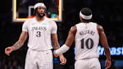 Mar 24, 2025; Brooklyn, New York, USA; Dallas Mavericks forward Anthony Davis (3) celebrates with Dallas Mavericks guard Brandon Williams (10) after basket during the second half against the Brooklyn Nets at Barclays Center. Mandatory Credit: Vincent Carchietta-Imagn Images