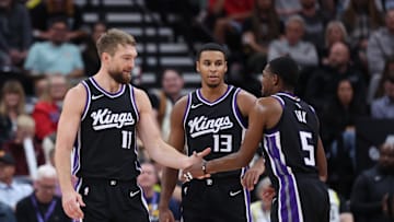 Oct 15, 2024; Salt Lake City, Utah, USA; Sacramento Kings forward Domantas Sabonis (11), forward Keegan Murray (13) and guard De'Aaron Fox (5) react to a play against the Utah Jazz during the second quarter at Delta Center. Mandatory Credit: Rob Gray-Imagn Images