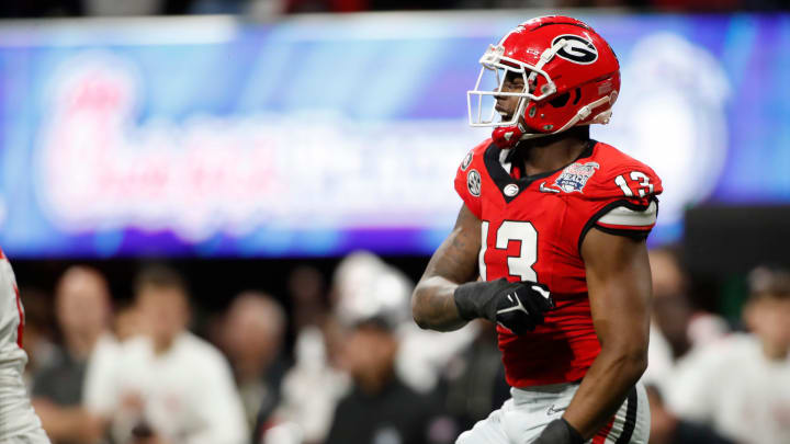 Georgia defensive lineman Mykel Williams (13) celebrates after sacking Ohio State quarterback C.J. Stroud (7) during the first half of the Chick-fil-A Peach Bowl NCAA College Football Playoff semifinal game on Saturday, Dec 31, 2022, in Atlanta.

News Joshua L Jones