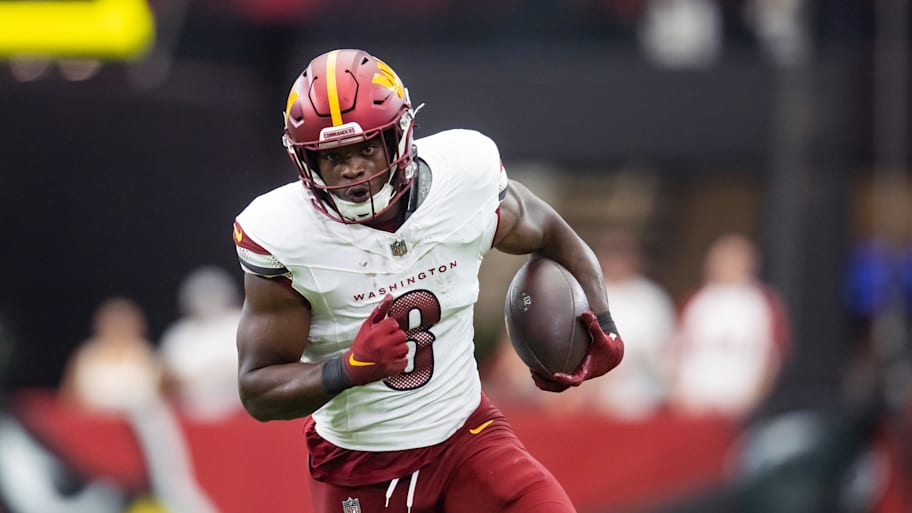 Sep 29, 2024; Glendale, Arizona, USA; Washington Commanders running back Brian Robinson Jr. (8) against the Arizona Cardinals at State Farm Stadium. Mandatory Credit: Mark J. Rebilas-Imagn Images | Mark J. Rebilas-Imagn Images