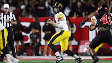 Sep 19, 2025; Piscataway, New Jersey, USA; Iowa Hawkeyes quarterback Mark Gronowski (11) drops back to pass during the first half against the Rutgers Scarlet Knights at SHI Stadium. Mandatory Credit: Vincent Carchietta-Imagn Images