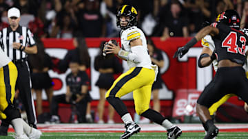 Sep 19, 2025; Piscataway, New Jersey, USA; Iowa Hawkeyes quarterback Mark Gronowski (11) drops back to pass during the first half against the Rutgers Scarlet Knights at SHI Stadium. Mandatory Credit: Vincent Carchietta-Imagn Images