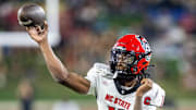 Sep 11, 2025; Winston-Salem, North Carolina, USA;  North Carolina State Wolfpack quarterback CJ Bailey (11) throws a pass in first half against the Wake Forest Demon Deacons at Allegacy Federal Credit Union Stadium. Mandatory Credit: Luke Jamroz-Imagn Images