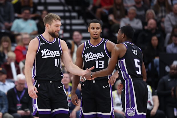 Sacramento Kings forward Domantas Sabonis (11), forward Keegan Murray (13) and guard De'Aaron Fox (5) 