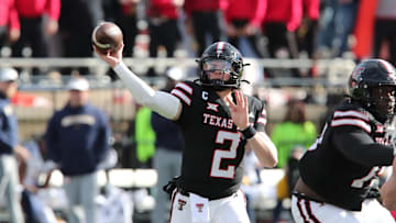 Nov 30, 2024; Lubbock, Texas, USA;  Texas Tech Red Raiders quarterback Behren Morton (2) throws  against the West Virginia Mountaineers in the second half at Jones AT&T Stadium and Cody Campbell Field. Mandatory Credit: Michael C. Johnson-Imagn Images