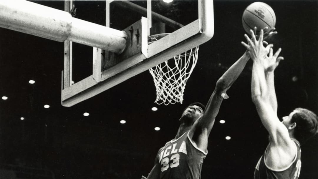 Unknown date & location, USA: FILE PHOTO; UCLA Bruins center Lew Alcindor (33) who later became known as Kareem Abdul-Jabbar grabs a rebound against the Houston Cougars during the 1967 season. Mandatory Credit: Malcolm Emmons- Imagn Images 