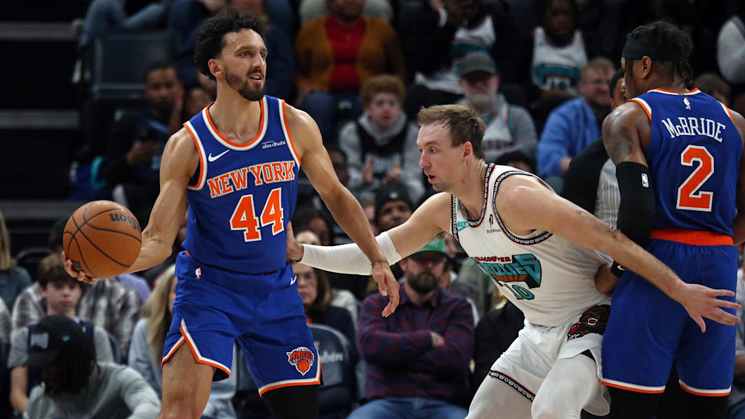 New York Knicks guard Landry Shamet handles the ball as Memphis Grizzlies guard Luke Kennard defends.