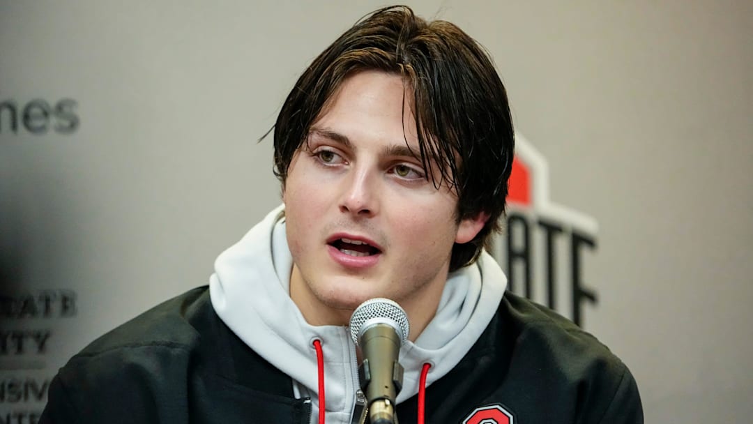 Ohio State Buckeyes quarterback Julian Sayin talks to media following the NCAA football game against the Michigan Wolverines at Michigan Stadium in Ann Arbor, Michigan. Ohio State won 27-9.