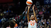 Sep 6, 2025; Uncasville, Connecticut, USA; Connecticut Sun guard Leila Lacan (47) shoots the ball against Phoenix Mercury guard Kahleah Copper (2) in the first half at Mohegan Sun Arena. 