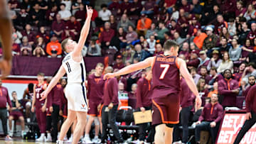 Feb 15, 2025; Blacksburg, Virginia, USA; Virginia Cavaliers guard Isaac McKneely (11) celebrates a three point basket during the second half against the Virginia Tech Hokies at Cassell Coliseum. Mandatory Credit: Brian Bishop-Imagn Images