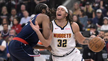 Apr 26, 2025; Inglewood, California, USA; Denver Nuggets forward Aaron Gordon (32) is defended by Los Angeles Clippers guard James Harden (1) as he drives to the basket in the first half of game four of round one of the 2024 NBA Playoffs at Intuit Dome. Mandatory Credit: Jayne Kamin-Oncea-Imagn Images
