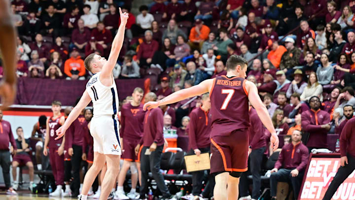Feb 15, 2025; Blacksburg, Virginia, USA; Virginia Cavaliers guard Isaac McKneely (11) celebrates a three point basket during the second half against the Virginia Tech Hokies at Cassell Coliseum. Mandatory Credit: Brian Bishop-Imagn Images