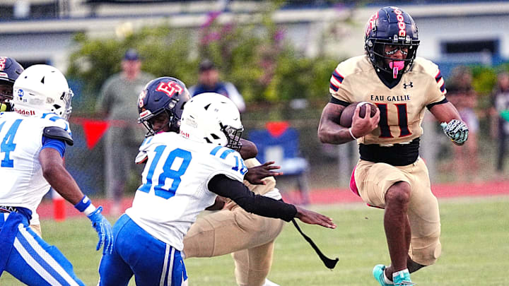 Star senior Xavier Lherisse of Eau Gallie runs the ball against Heritage on Sept. 5. The Oregon commit has led the Commodores to a 4-2 start and the No. 10 ranking in this week's High School on SI Central Florida Top 10. Star senior Xavier Lherisse of Eau Gallie runs the ball against Heritage on Sept. 5. The Oregon commit has led the Commodores to a 4-2 start and the No. 10 ranking in this week's High School on SI Central Florida Top 10.