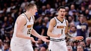 Mar 21, 2024; Denver, Colorado, USA; Denver Nuggets forward Michael Porter Jr. (1) and center Nikola Jokic (15) in the third quarter against the New York Knicks at Ball Arena. Mandatory Credit: Isaiah J. Downing-Imagn Images
