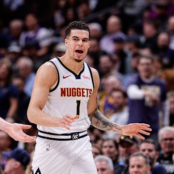 Mar 21, 2024; Denver, Colorado, USA; Denver Nuggets forward Michael Porter Jr. (1) and center Nikola Jokic (15) in the third quarter against the New York Knicks at Ball Arena. Mandatory Credit: Isaiah J. Downing-Imagn Images