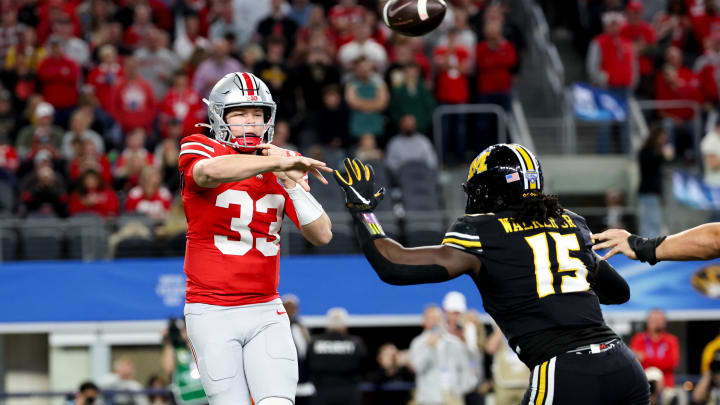 Dec 29, 2023; Arlington, TX, USA;  Ohio State Buckeyes quarterback Devin Brown (33) passes over Missouri Tigers defensive lineman Johnny Walker Jr. (15) during the first quarter at AT&T Stadium. Mandatory Credit: Kevin Jairaj-USA TODAY Sports