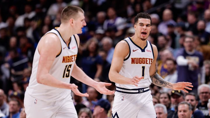 Denver Nuggets forward Michael Porter Jr. (1) and center Nikola Jokic (15) in the third quarter against the New York Knicks at Ball Arena. Mandatory Credit: 