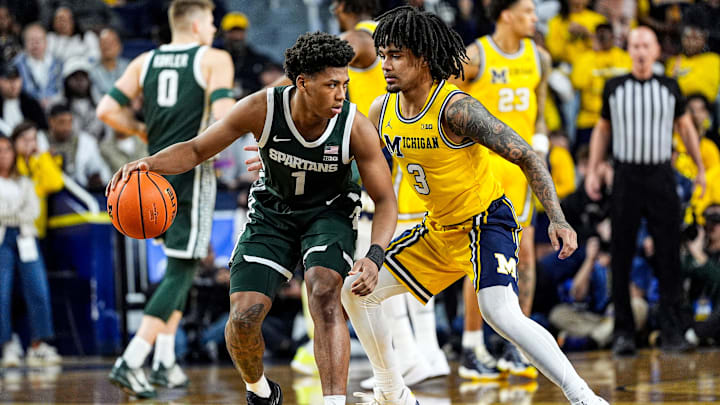 Michigan State guard Jeremy Fears Jr. (1) dribbles against Michigan guard Elliot Cadeau (3) during the first half at Crisler Center in Ann Arbor on Sunday, March 8, 2026.