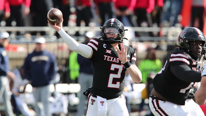 Nov 30, 2024; Lubbock, Texas, USA;  Texas Tech Red Raiders quarterback Behren Morton (2) throws  against the West Virginia Mountaineers in the second half at Jones AT&T Stadium and Cody Campbell Field. Mandatory Credit: Michael C. Johnson-Imagn Images