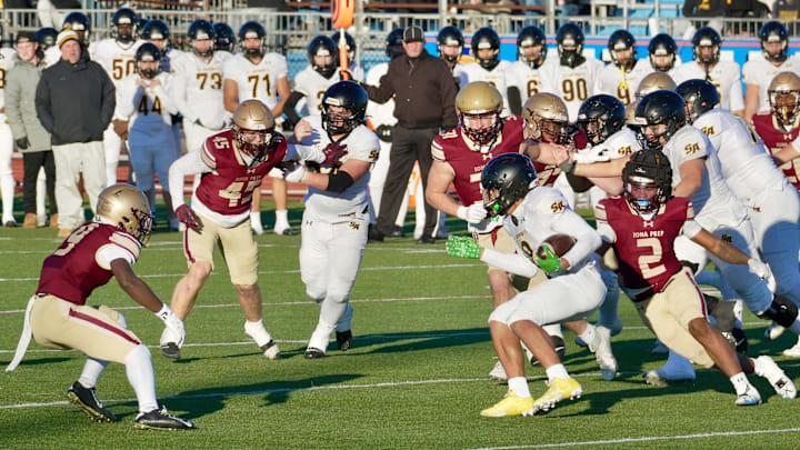 St. Anthony's Xavier Bala runs the ball against Iona Prep in the CHSFL AAA championship game at Mitchel Athletic Complex in Uniondale on Nov. 23, 2024.