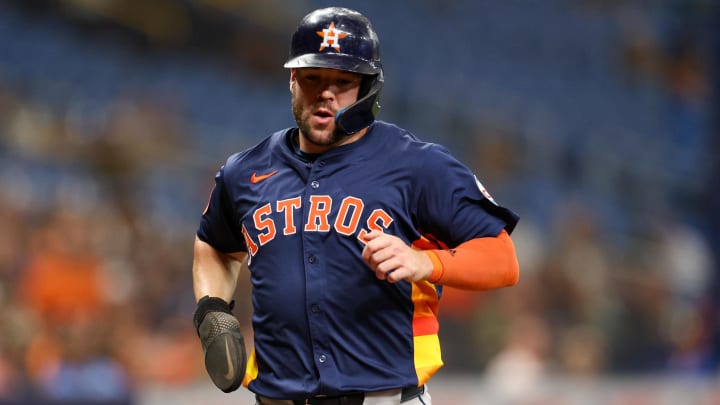 Aug 12, 2024; St. Petersburg, Florida, USA; Houston Astros outfielder Chas McCormick (20) scores a run against the Tampa Bay Rays in the third inning at Tropicana Field