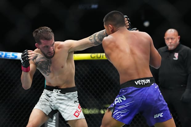 Cody Durden (red gloves) fights Joshua Van (blue gloves) at T-Mobile Arena.