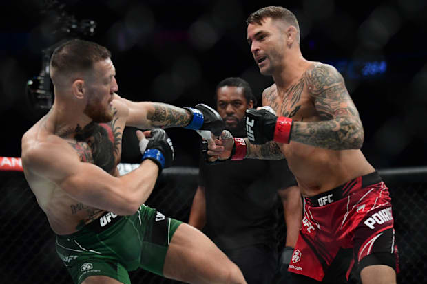 Dustin Poirier moves in for a hit against Conor McGregor during UFC 264 at T-Mobile Arena. 