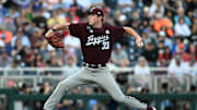 Jun 19, 2024; Omaha, NE, USA;  Texas A&M Aggies starting pitcher Justin Lamkin (33) throws against the Florida Gators during the first inning at Charles Schwab Field Omaha. Mandatory Credit: Steven Branscombe-Imagn Images
