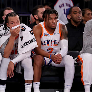 Jan 10, 2025; New York, New York, USA; New York Knicks center Karl-Anthony Towns (32) and guards Jalen Brunson (11) and Miles McBride (2) watch from the bench during the fourth quarter against the Oklahoma City Thunder at Madison Square Garden. Mandatory Credit: Brad Penner-Imagn Images