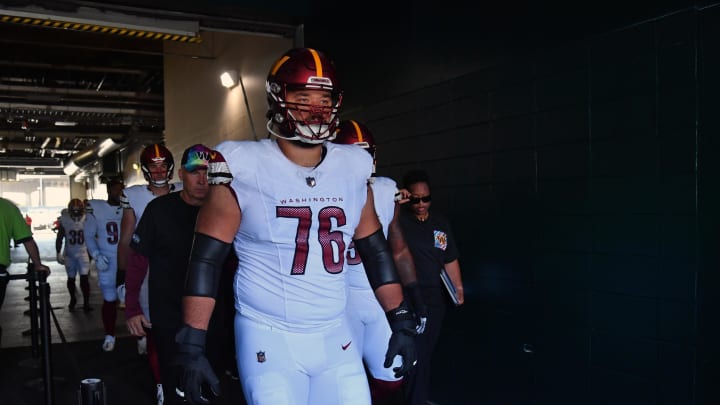 Oct 1, 2023; Philadelphia, Pennsylvania, USA; Washington Commanders offensive tackle Sam Cosmi (76) leads his team in the tunnel against the Philadelphia Eagles at Lincoln Financial Field. Mandatory Credit: Eric Hartline-USA TODAY Sports