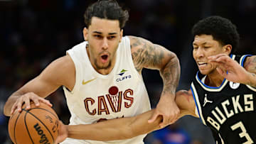 Dec 20, 2024; Cleveland, Ohio, USA; Cleveland Cavaliers forward Jaylon Tyson (24) drives to the basket against Milwaukee Bucks forward MarJon Beauchamp (3) during the second half at Rocket Mortgage FieldHouse. Mandatory Credit: Ken Blaze-Imagn Images