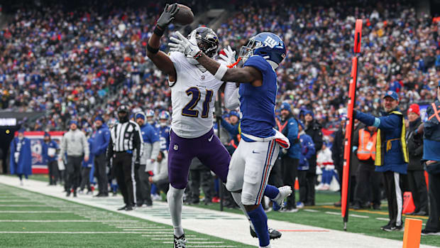 Baltimore Ravens cornerback Brandon Stephens breaks up a pass intended for New York Giants wide receiver Malik Nabers.