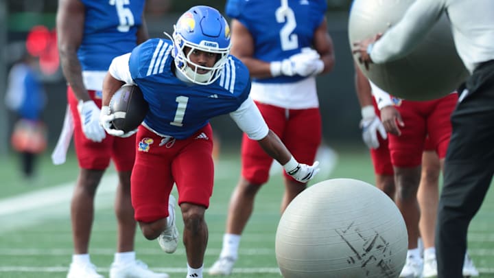 Kansas junior running back Dylan Edwards (1) works on drills during practice at the University of Kansas on Thursday, April 9, 2026.