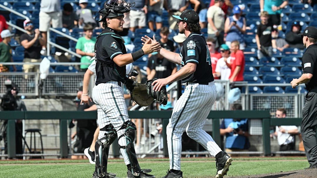Jun 18, 2025; Omaha, Neb, USA; Coastal Carolina Chanticleers pitcher Dominick Carbone (40) and catcher Caden Bodine (17) meet after the win against the Coastal Carolina Chanticleers at Charles Schwab Field. Mandatory Credit: Steven Branscombe-Imagn Images Jun 18, 2025; Omaha, Neb, USA; Coastal Carolina Chanticleers pitcher Dominick Carbone (40) and catcher Caden Bodine (17) meet after the win against the Coastal Carolina Chanticleers at Charles Schwab Field. Mandatory Credit: Steven Branscombe-Imagn Images
