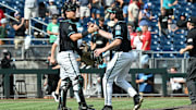 Jun 18, 2025; Omaha, Neb, USA;  Coastal Carolina Chanticleers pitcher Dominick Carbone (40) and catcher Caden Bodine (17) meet after the win against the Coastal Carolina Chanticleers at Charles Schwab Field. Mandatory Credit: Steven Branscombe-Imagn Images