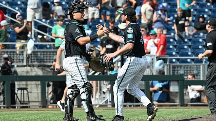 Jun 18, 2025; Omaha, Neb, USA; Coastal Carolina Chanticleers pitcher Dominick Carbone (40) and catcher Caden Bodine (17) meet after the win against the Coastal Carolina Chanticleers at Charles Schwab Field. Mandatory Credit: Steven Branscombe-Imagn Images Jun 18, 2025; Omaha, Neb, USA; Coastal Carolina Chanticleers pitcher Dominick Carbone (40) and catcher Caden Bodine (17) meet after the win against the Coastal Carolina Chanticleers at Charles Schwab Field. Mandatory Credit: Steven Branscombe-Imagn Images