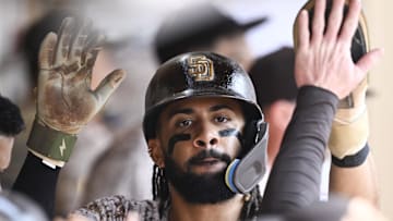 Aug 3, 2025; San Diego, California, USA; San Diego Padres right fielder Fernando Tatis Jr. (23) is congratulted after scoring during the seventh inning against the St. Louis Cardinals at Petco Park. Mandatory Credit: Denis Poroy-Imagn Images