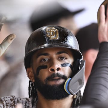 Aug 3, 2025; San Diego, California, USA; San Diego Padres right fielder Fernando Tatis Jr. (23) is congratulted after scoring during the seventh inning against the St. Louis Cardinals at Petco Park. Mandatory Credit: Denis Poroy-Imagn Images