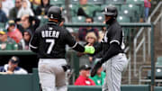 Chicago White Sox catcher Edgar Quero (7) and center fielder Luis Robert Jr. (88) score at Sutter Health Park. 