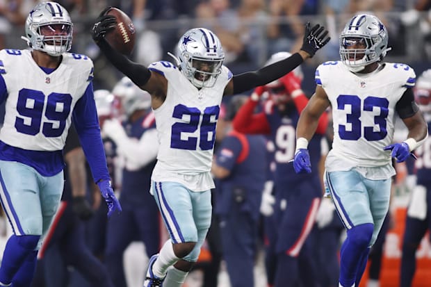 Dallas Cowboys CB DaRon Bland celebrates an interception with his teammates in the fourth quarter against New England.